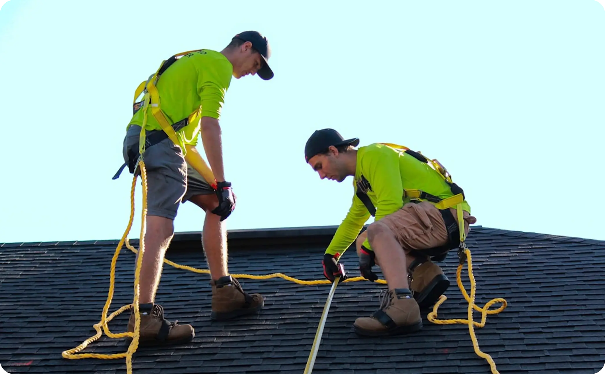 Roofer working on a metal roof