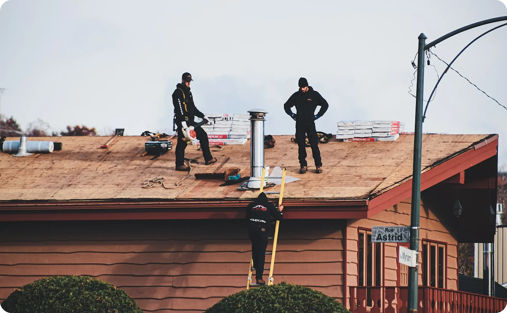 Roofer working on a metal roof