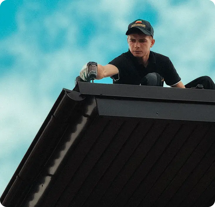 Roofer working on a tiled roof