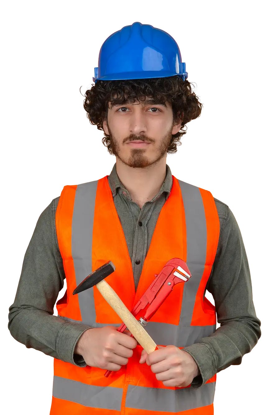 Man in orange safety vest and blue hard hat holding a hammer and red pipe wrench.
