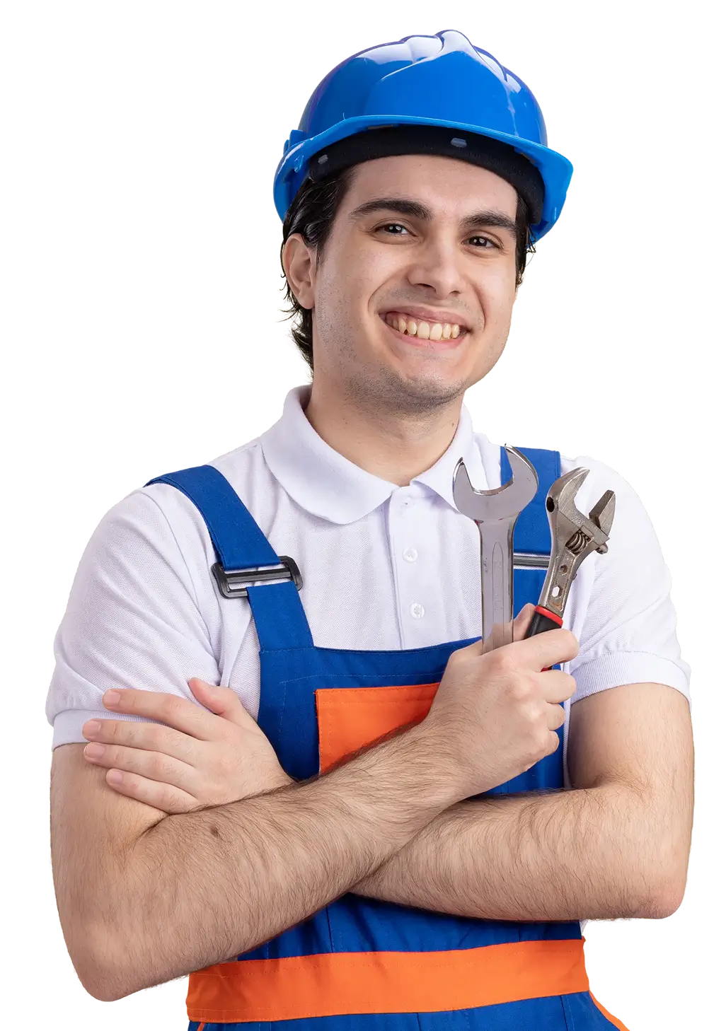 Smiling repairman in blue hard hat and overalls holding a wrench and an adjustable spanner.